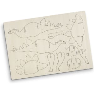 A wooden model kit featuring a stegosaurus design with intricately cut pieces for assembly. The model is light brown.