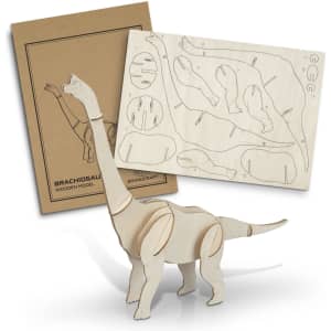 A Brachiosaurus wooden model in natural wood colour, alongside a sheet of pre-cut wooden pieces and packaging.