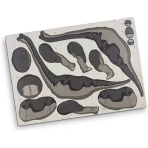 A wooden puzzle kit featuring Brachiosaurus parts in black and grey, neatly arranged on a light wood base with a logo.