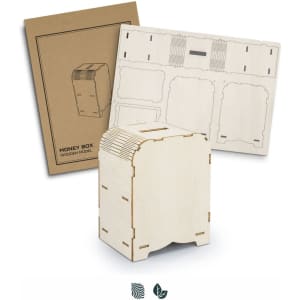 A wooden money box model in a natural finish, displayed with its packaging and assembly parts.