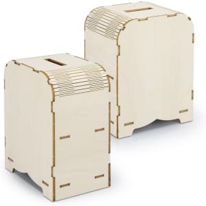 A wooden money box model in a light colour with a slot for coins. Features intricate cut-out details on the top.
