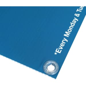 A blue Core Flute sign featuring eyelets for hanging. It includes a logo and promotional text on the right.