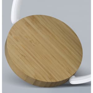A circular wireless charging night light with a bamboo wood top and a white base. It features a sleek, modern design.