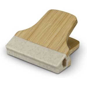 A bamboo clip with a light beige silicone grip, showcasing a natural wood finish and smooth edges.