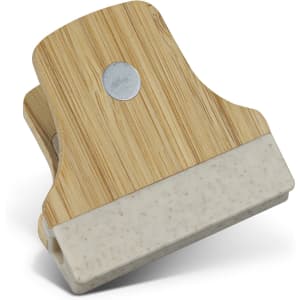 A bamboo clip featuring a natural wood finish with a white base, showcasing a round metal accent.