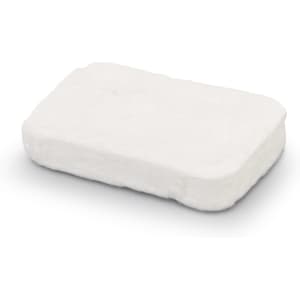 A small, rectangular, compressed white towel product with a smooth texture. It features a logo on one side.