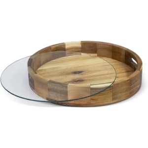 A wooden tray with a textured finish and a removable glass top, featuring circular handles for easy carrying.