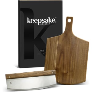 A wooden cheese board and knife set, featuring a stainless steel blade, packaged in a sleek black box with a logo.