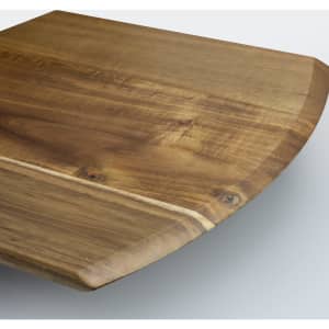 A wooden cheese board with a smooth surface and rounded edges in a natural brown tone, featuring a rustic finish.