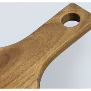 A wooden pizza board with a smooth finish and a circular hole in the handle.