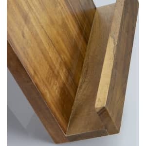 A wooden recipe book holder in a warm tone, featuring a slanted design for easy page viewing.