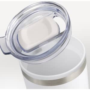 A double wall cup in white, with a clear lid and silver band. The lid features a sliding opening for drinking.