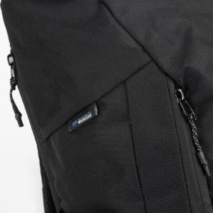 A black roll-up computer backpack featuring detailing and a logo on the side. Zippers are visible for secure closure.
