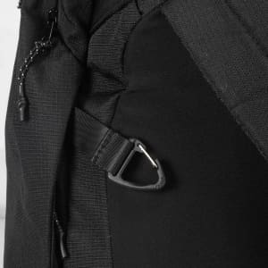 A black backpack featuring side straps and a sturdy clip. It has a sleek, modern design.