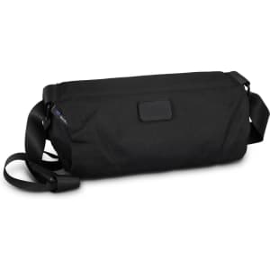 A black sling bag with a sturdy strap and a zip closure, featuring a logo on the side.