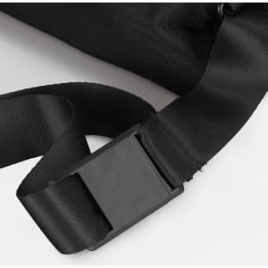 A black sling bag featuring a sturdy strap and buckle closure, with a textured fabric surface.