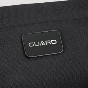 A black sling bag with a rectangular logo featuring the word "GUARD" prominently displayed.