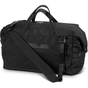 A black duffle bag featuring a shoulder strap and dual handles, with a simplistic design and a logo on it.