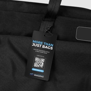 A black duffle bag with a handle and a tag featuring a QR code and branding.