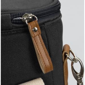 A black wine cooler bag with a textured surface, featuring a zipper and a tan leather handle.