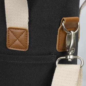 A wine cooler bag in dark fabric with a beige strap and leather accents, featuring a metal clip and stitching details.