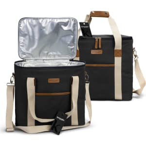 A black cooler bag with a silver interior, featuring a zippered front pocket and a detachable shoulder strap.