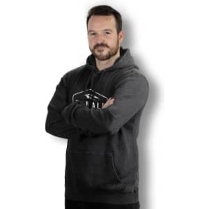 A faded unisex hoodie in charcoal grey with a front pocket and a logo on the chest.