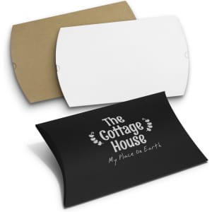 Three pillow boxes in black, white, and brown. The black box features a logo or branding.