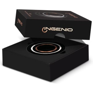 A black box containing a circular, wireless charger with a sleek design, featuring a branding logo.