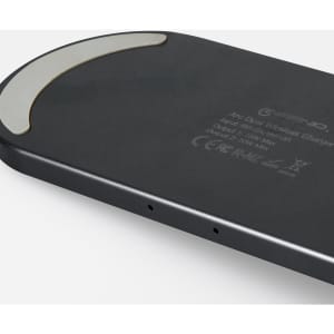 A black wireless charger with a curved design and a silver accent. It features branding on the surface.