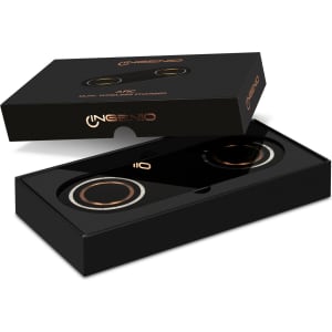 A black packaging box featuring a dual wireless charger with gold accents and a logo.