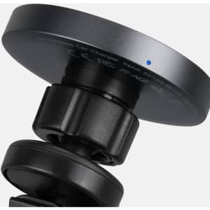 A wireless car charger in black with a round charging pad and an adjustable mount. It features a small blue indicator light.