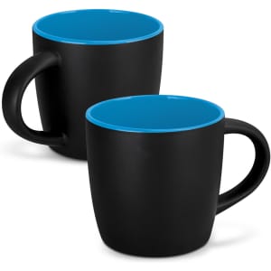 A drinkware set featuring two black mocha coffee mugs with blue interiors and handles, including a logo.
