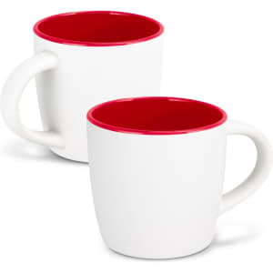 A two-tone coffee mug featuring a white exterior and a red interior, with a curved handle and a logo.