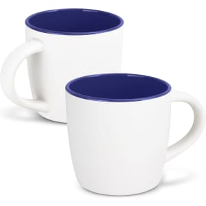 A two-toned mocha coffee mug featuring a white exterior and a navy blue interior, with a simple handle and a logo.