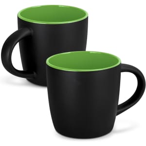 A black coffee mug with a green interior, featuring a smooth finish and a handle. Includes a logo.