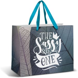 A large paper bag featuring a full colour design with teal ribbon handles and a textured leaf pattern.