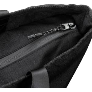 A black cooler bag featuring a zippered closure and sturdy straps. It has a textured interior lining.