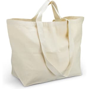 A cream tote bag with long handles, featuring a simple design and a spacious interior.