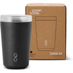 A drink bottle in obsidian black with a silver lid, next to a cardboard box featuring a logo.