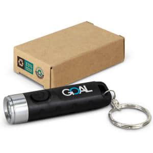 A black rechargeable torch keyring with a silver end, next to a brown cardboard box. It features a logo.
