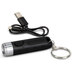 A black rechargeable torch keyring with a silver front, accompanied by a USB charging cable.