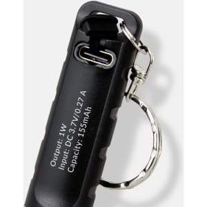 A black rechargeable torch keyring featuring a metal attachment for convenience and a USB charging port.