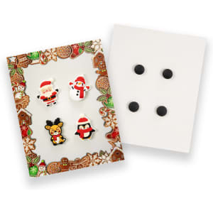 A pack of four custom shoe charms featuring Santa, a snowman, a penguin, and a reindeer, all in festive colours.