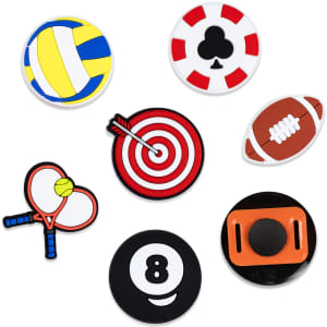 A collection of seven custom shoe charms in various colours, featuring sports and gaming designs like volleyball, poker, and darts.