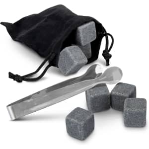 A black pouch containing grey whiskey stones and stainless steel tongs, arranged on a white background.
