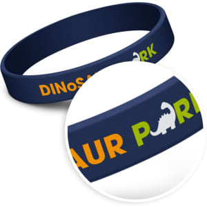 A navy silicone wristband featuring colourful text and a logo, ideal for children's events.