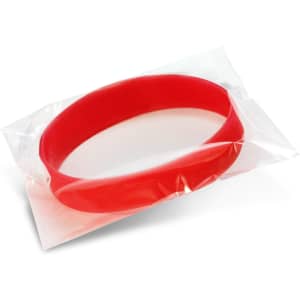 A red silicone wristband displayed in a clear plastic pouch, with a simple, smooth design.