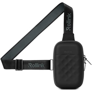 A compact black bag with a quilted texture, featuring an adjustable strap and a logo.