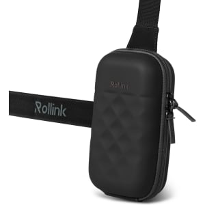A black travel pouch with a textured surface and an adjustable strap. It features a logo on the front.